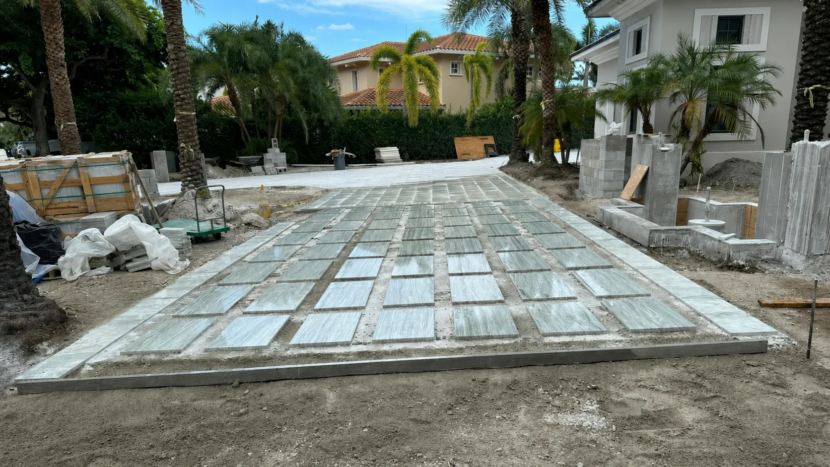 Travertine driveway with artificial turf in Fort Lauderdale